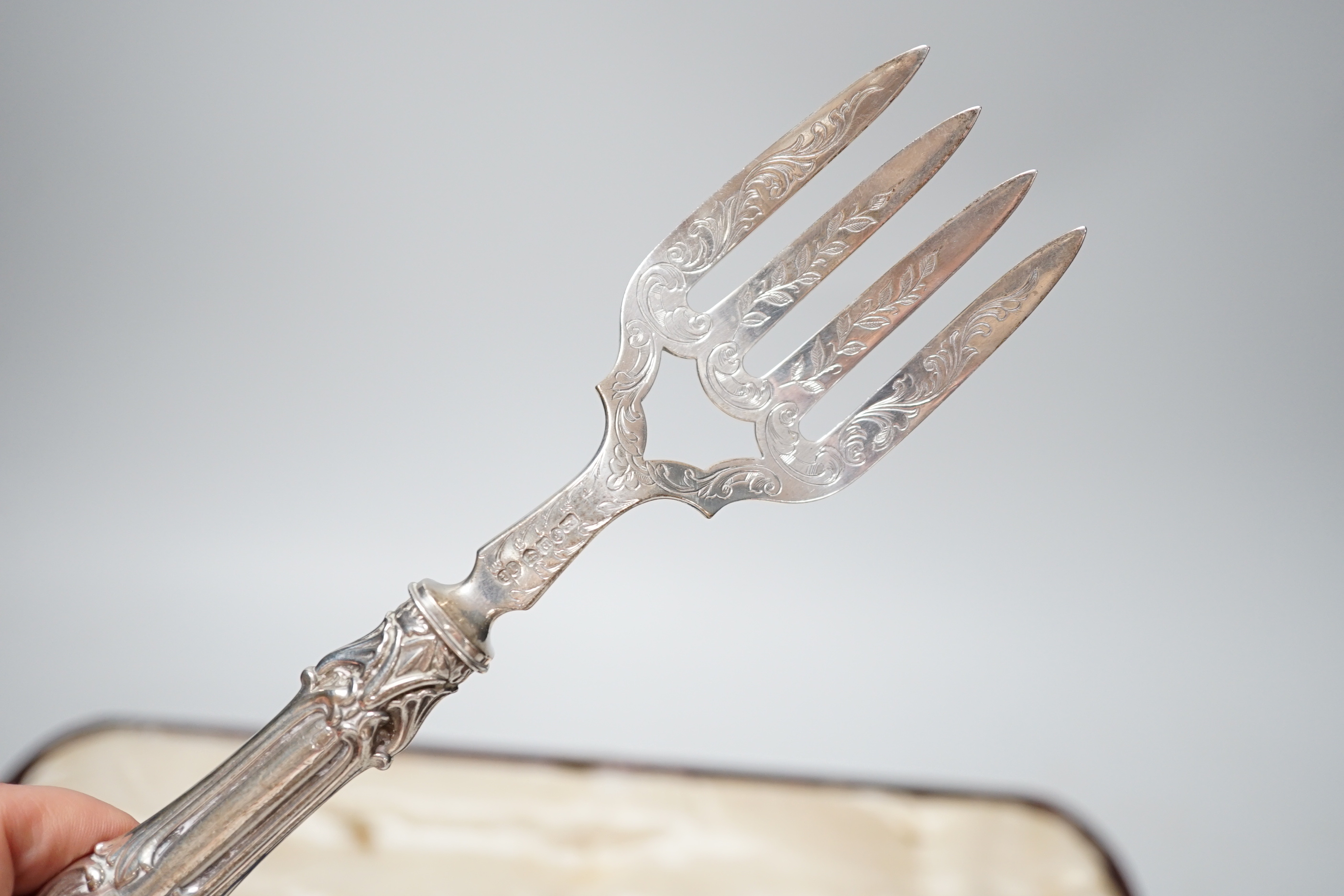 A cased pair of Victorian silver fish servers, John Gilbert, Birmingham, 1853, knife 32.5cm.